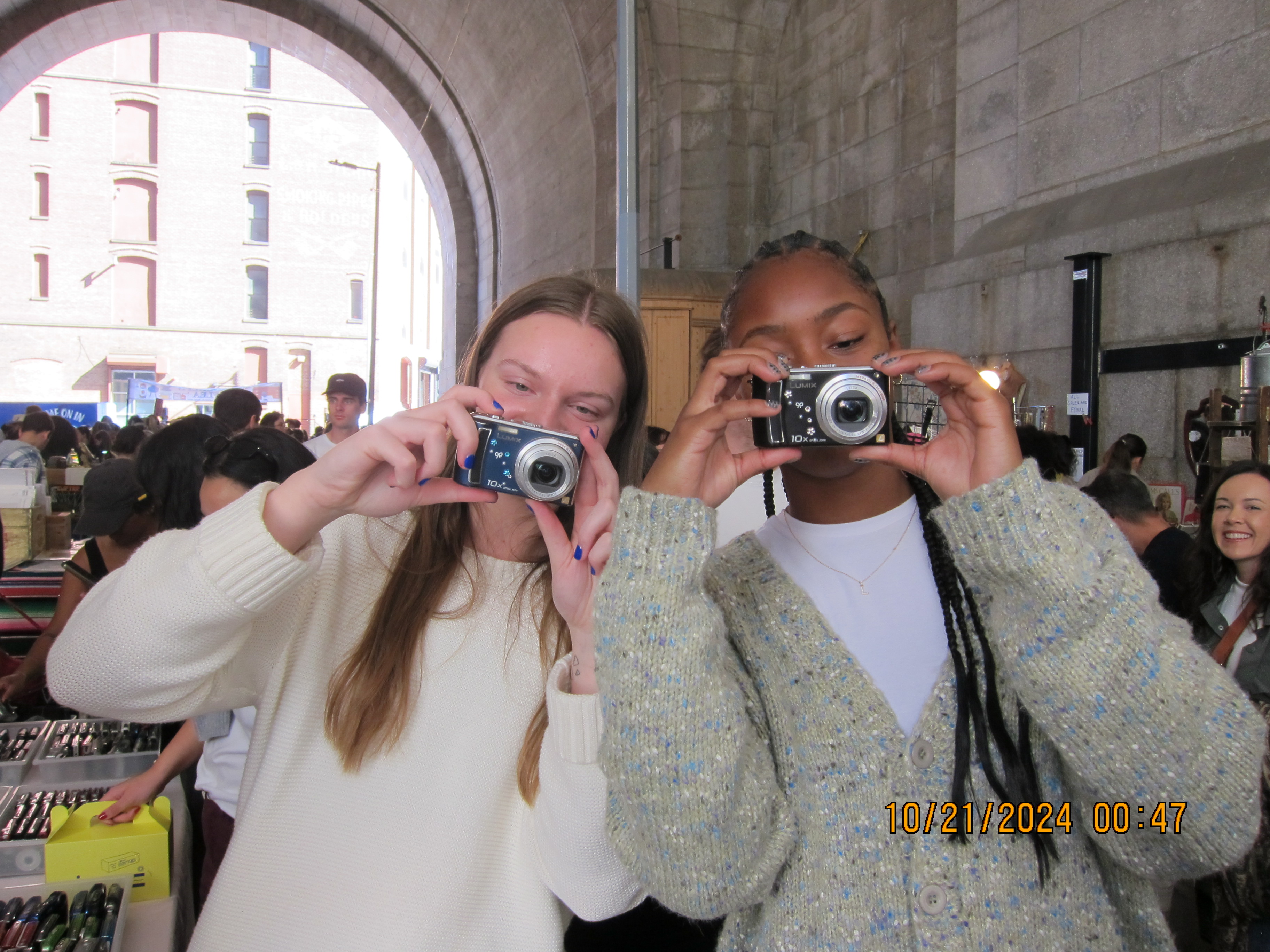 Photo of jordan taking a photo with her friend.